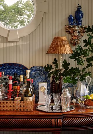 Max Sinsteden has done similar in his beach cottage where a 19thcentury mahogany sideboard made in Cork Ireland holds a...