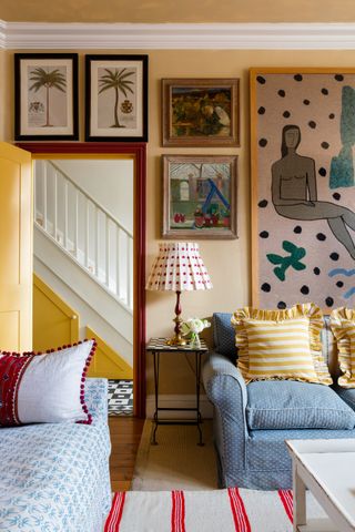 Image may contain Cushion Living Room Room Indoors Pillow Home Decor Lamp Table Lamp Interior Design and Furniture