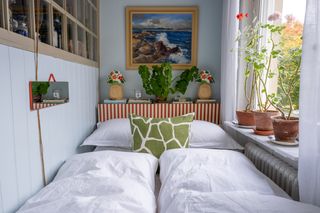 Image may contain Room Bedroom Indoors Interior Design Furniture Home Decor Bed Plant Living Room and Flower