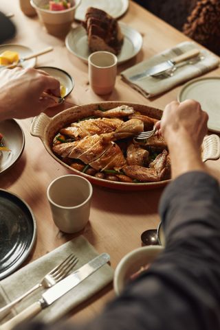 Image may contain Brunch Food Cutlery Fork Cup Blade Knife Weapon Plate Bread Adult Person and Baby