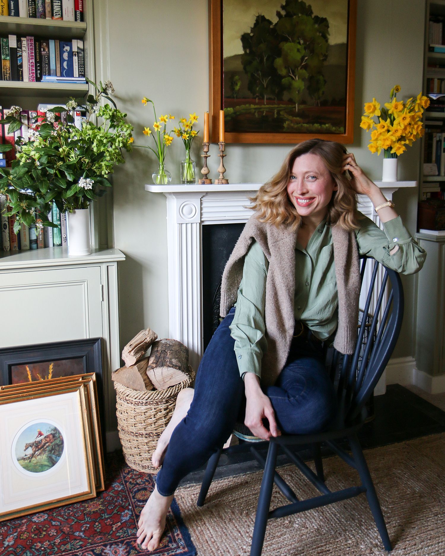 Image may contain Furniture Chair Plant Human Person Home Decor Flower Blossom Wood Indoors and Flower Arrangement