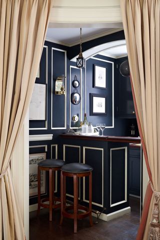 Image may contain Furniture Bar Stool Indoors Room and Curtain