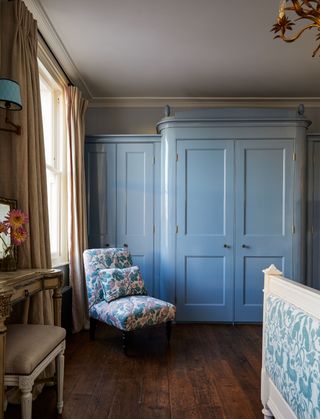 Image may contain Interior Design Indoors Flooring Floor Furniture Wood Corner Hardwood Room Door and Living Room
