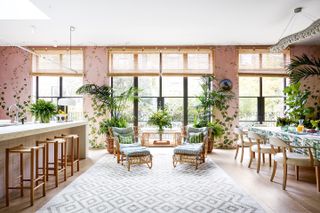 Image may contain Furniture Lobby Room Indoors Interior Design Flooring Table Rug Floor and Chair
