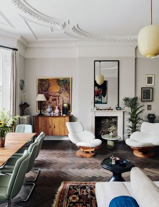 Image may contain Room Indoors Living Room Interior Design Furniture Chair Home Decor Rug Flooring and Table