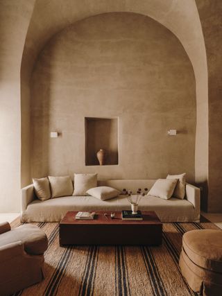 Image may contain Book Publication Home Decor Architecture Building Furniture Indoors Living Room Room and Couch