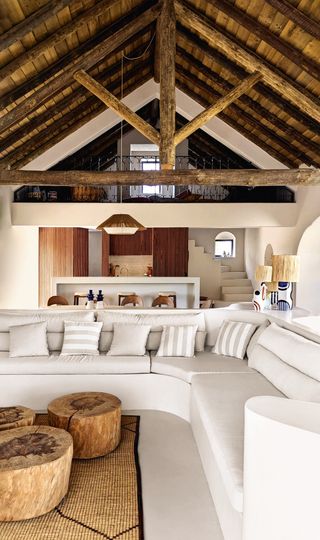 Image may contain Indoors Interior Design Lamp Architecture Building House Housing Loft Room and Furniture