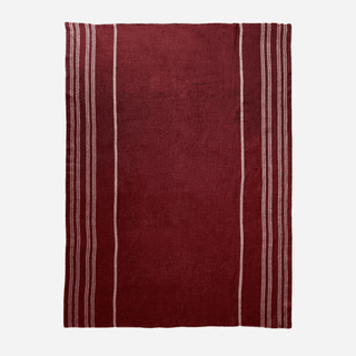 Image may contain Home Decor Rug Maroon Clothing and Shirt